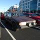 Lifted Volvo next to a contemporary family member